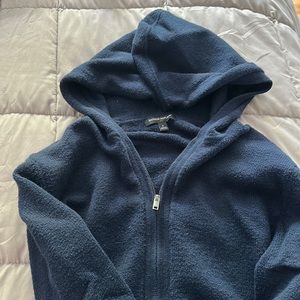 Blue, never worn, just sat in my closet, hooded zip up sweater.
